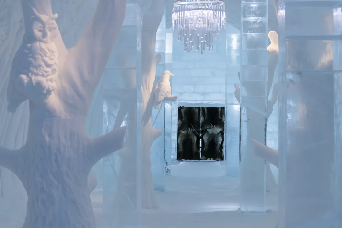Vaulted hall of packed snow with carved openings along both sides